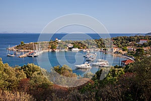 Port of Kastos island with moored yachts, sailboats, boats - Ionian sea, Greece in summer.