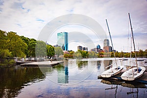 Port near a lake in New York city under the clear sky with buildings surrounding the port