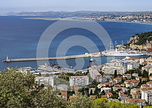 Port of Nice with a large white tourboat and small lighthourse