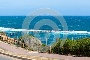 The Port Noarlunga Jetty with rough seas in Adelaide South Australia on 6th November 2019