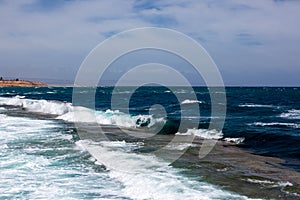 The Port Noarlunga reef in rough seas looking from the jetty in Adelaide South Australia on 6th November 2019