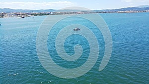 Port of olbia with panorama plate and motorboat