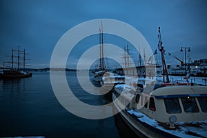 Port in Oslo Norway during sunset in winter view View of the sea and anchored boats