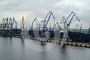 The port`s cranes preparing for transportation of the cargo