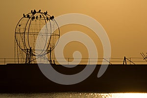 The port of salonicco at sunset with an art installation on the