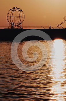 The port of salonicco at sunset with an art installation on the