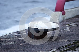 Port scene with metal objet for ship rope