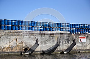 Port of ship with blue barrels