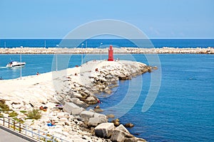 Port of trani blue sea white rocks