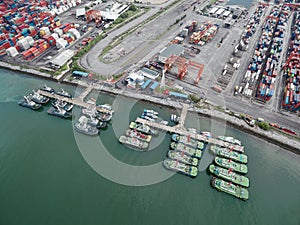 Port of tug boat in shipping yard at sea .