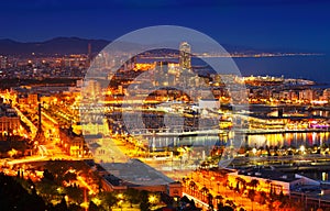 Port Vell and Barcelona cityspace in night