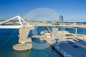 Port Vell with its cruise terminal, bridge Porta d`Europa and W Barcelona