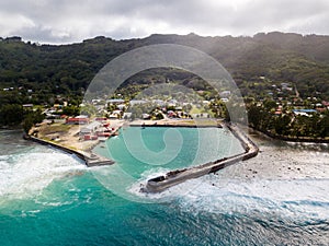 The port and village of Moerai, Rurutu island, Austral islands Tubuai islands, French Polynesia. Aerial view.
