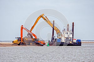 Port of Wells dredger extracting sand from Wells beach.