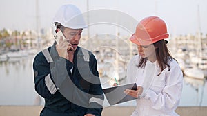 Port workers filling documents for yacht registration