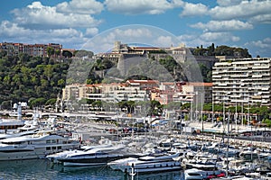 Port with yachts and Prince's Palace of Monaco cityscape