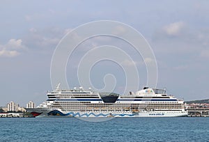 Port of Zadar, Croatia - 9 8 2018: Tourist cruise liner moored in Adriatic`s city. Dalmatian Riviera takes tourists. Multi-deck l