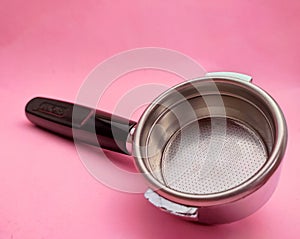 porta filter and tamper barista equipment on pink background