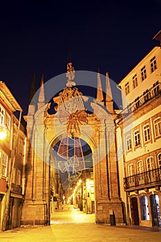 Porta Nova arch in Braga at dawn.
