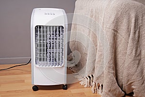 Portable air cooler and humidifier in living room