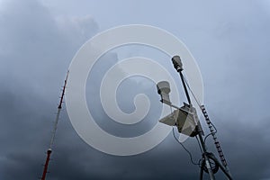 Portable Automatic Weather Station at Ngurah Rai airport under the scary dark Cumulonimbus clouds. This tool has a function to