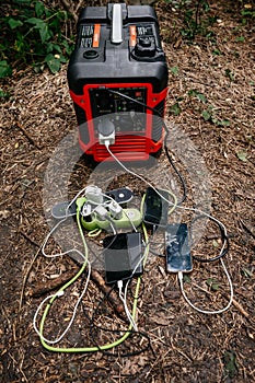 Portable charging station with mobile phones in nature.