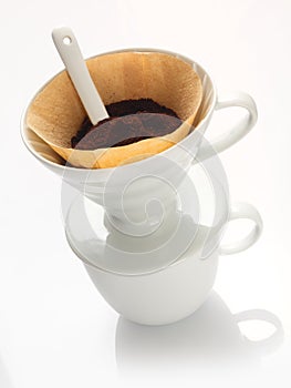 Portable china filter with ground coffee