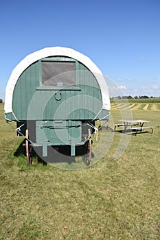 Portable covered wagon bunkhouse