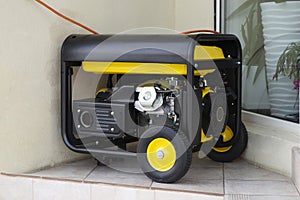 Portable electric generator running in the cold winter.Energy genocide. Power outage as a result of missile strikes by Russia on