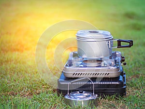 Pot stands on a portable gas stove. cooking on camping concept.