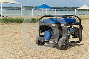 Portable gasoline power generator and high peak frame tent photo