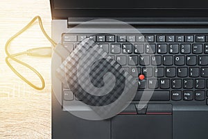 A portable hdd connected to a laptop computer