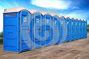 Portable plastic toilets in a row