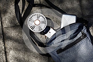 Portable rechargeable electric fan in a bag