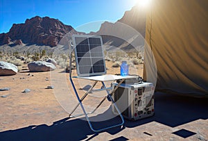 Portable solar panel, battery and table in mountains. View from the side, AI generative, AI generated illustration