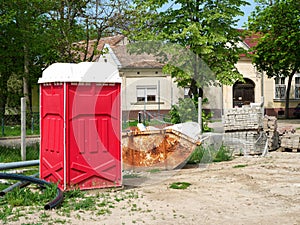 Portable toilet at the construction site