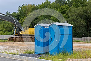 Portable toilet at construction site for worker in a building