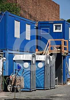 Portable toilets and containers at the construction site