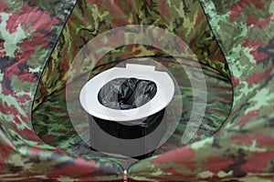 Portable toilets in tent at camping public