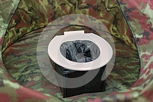 Portable toilets in tent at camping public