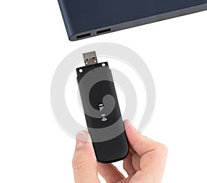 Portable usb modem and hand on a white background.