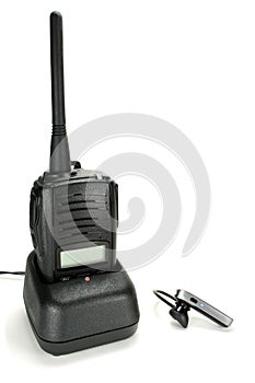 Portable walkie-talkie with headset isolated on a white background