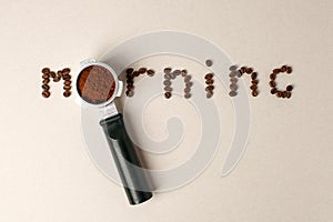 Portafilter and coffee beans - word morning, conceptual minimal background