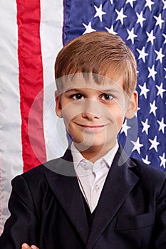 Portait of Caucasian boy with American flag