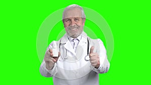 Portait of old man commend pills.