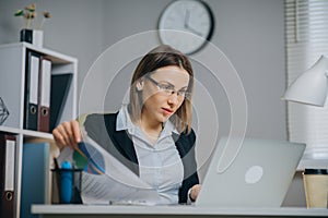 Portait of Pensive Business Lady Office Worker at Workplace. Confident Young Businesswoman Working With Data From