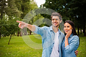 Portait of pretty man pointing with his index finger and shocked woman with brunette hair touch her cheek scream wear