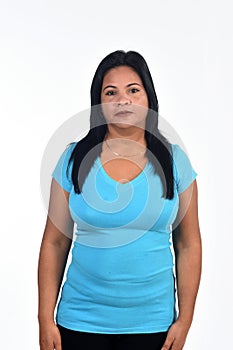 Portait of serious woman on white background