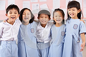 Portait Of Students In Chinese School Classroom
