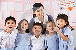 Portait Of Teacher And Students In Chinese School